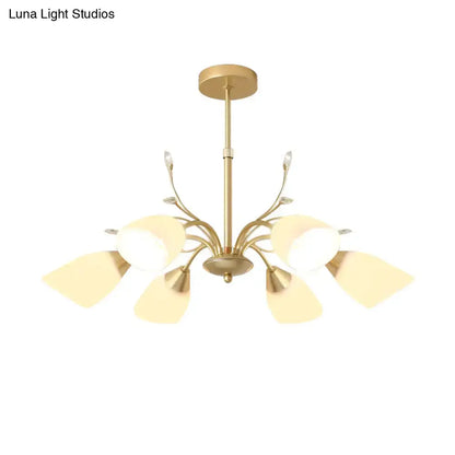 Gold glass chandelier with curved gold arms and frosted glass shades on Tampa Home & Garden Store