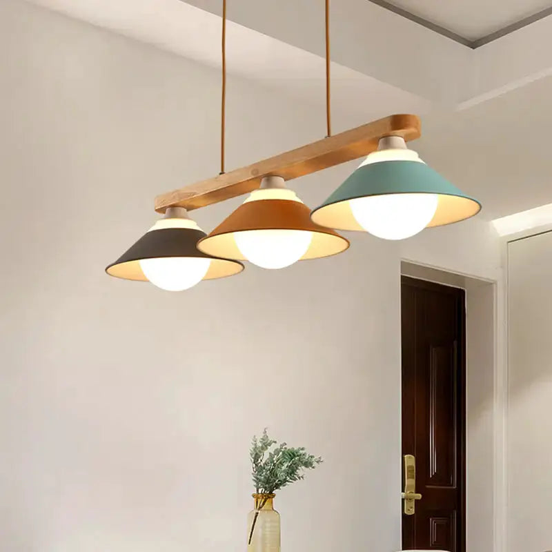 Modern three-light island pendant with wood beam in charcoal, tan and teal shades on Tampa Home & Garden Store