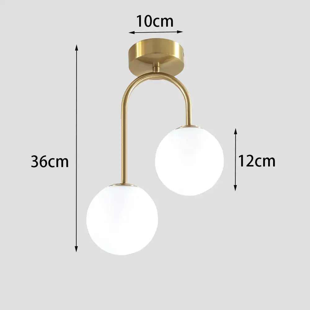 Brass Ball Ceiling Light by Decorbites, dual glass globes on curved arms on Tampa Home & Garden Store