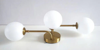 Brass ball ceiling light flush mount with three white glass globes Decorbites on Tampa Home & Garden Store
