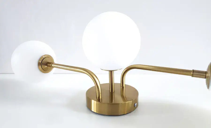 Decorbites Brass Ball Ceiling Light flush mount with three white globe bulbs on Tampa Home & Garden Store
