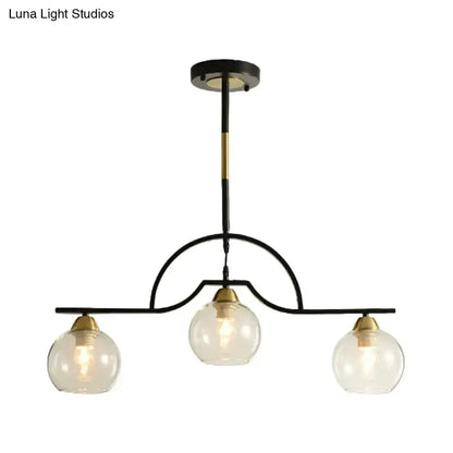 Modern black & brass arched pendant light with three clear glass globes by Decorbites on Tampa Home & Garden Store