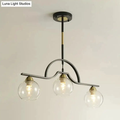 Modern black & brass arched pendant light with three glass globes kitchen by Decorbites on Tampa Home & Garden Store