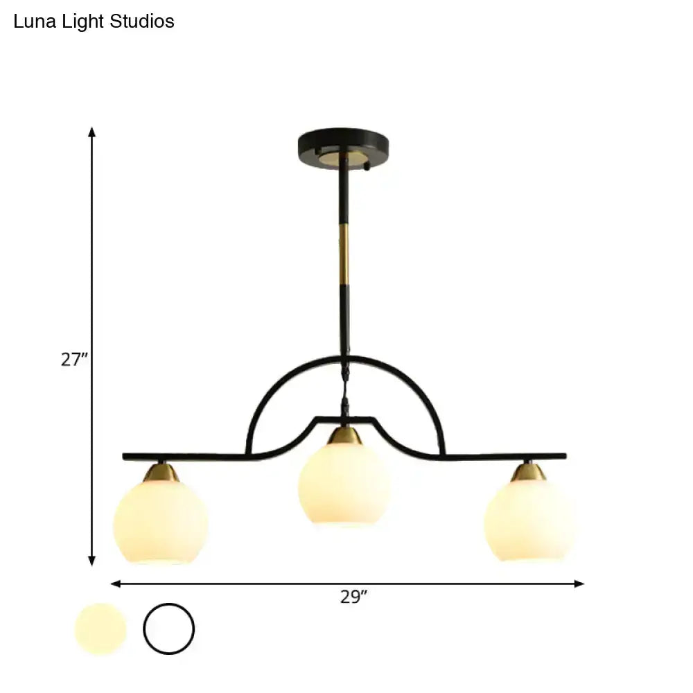 Decorbites modern black brass arched pendant light with three clear white glass shades on Tampa Home & Garden Store