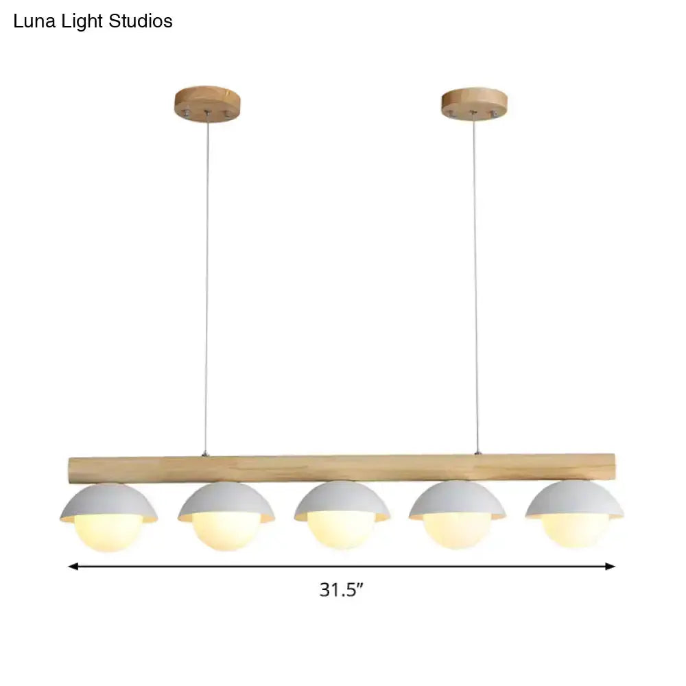 Decorbites modern wood LED island pendant with 5 white dome shades over a natural wood bar on Tampa Home & Garden Store