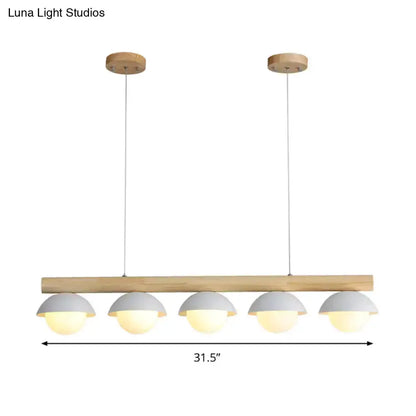 Decorbites modern wood LED island pendant with 5 white dome shades over a natural wood bar on Tampa Home & Garden Store