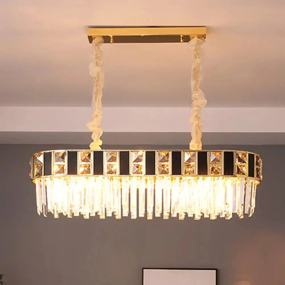 Oval black and gold crystal island pendant light with faceted prisms and fabric-wrapped cords on Tampa Home & Garden Store