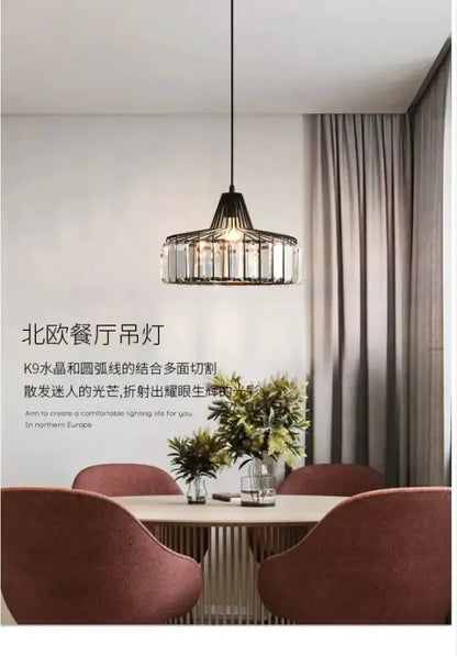 Modern black and gold crystal glass pendant lamp LED by Decorbites dining table with pink chairs on Tampa Home & Garden Store