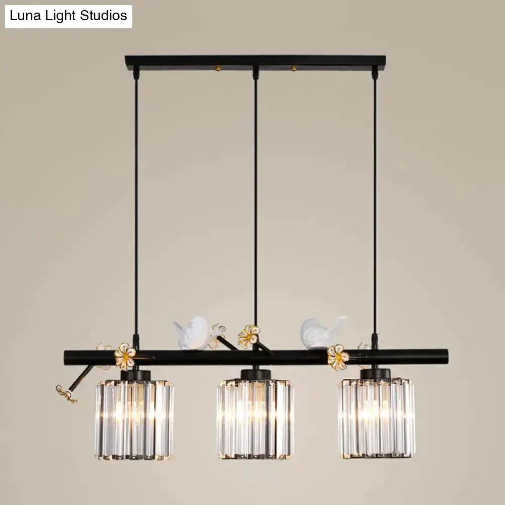 Decorbites modern black cylinder island pendant with three glass shades and bird accents on Tampa Home & Garden Store