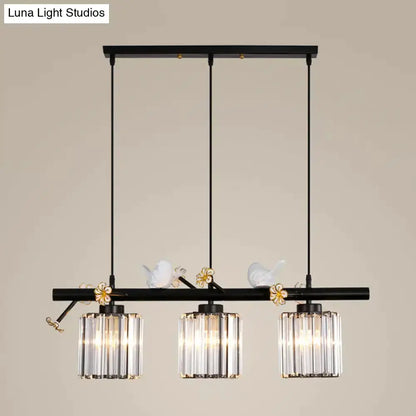 Decorbites modern black cylinder island pendant with three glass shades and bird accents on Tampa Home & Garden Store