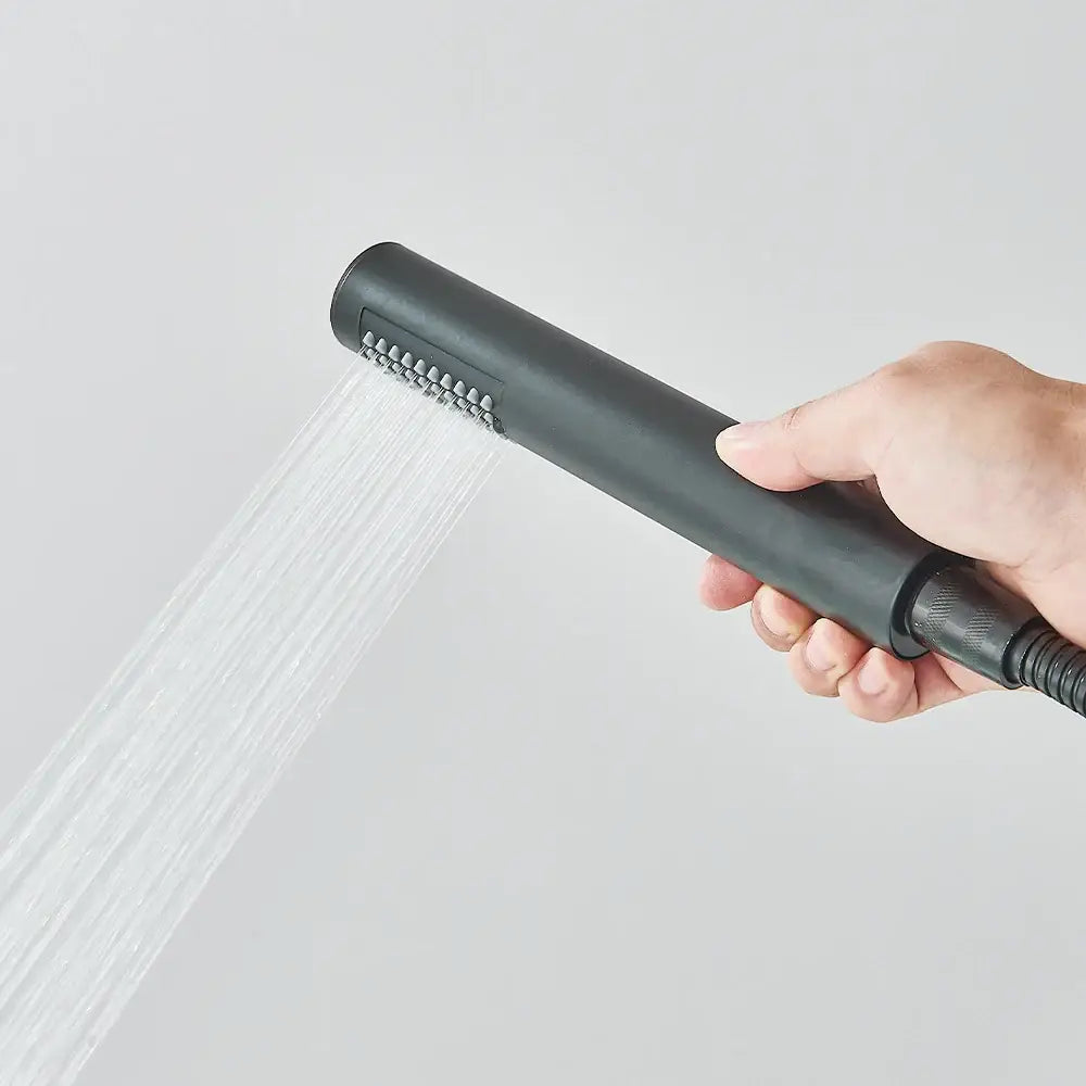 Matte black Decorbites freestanding bathroom sink faucet handheld spray nozzle in use on Tampa Home & Garden Store