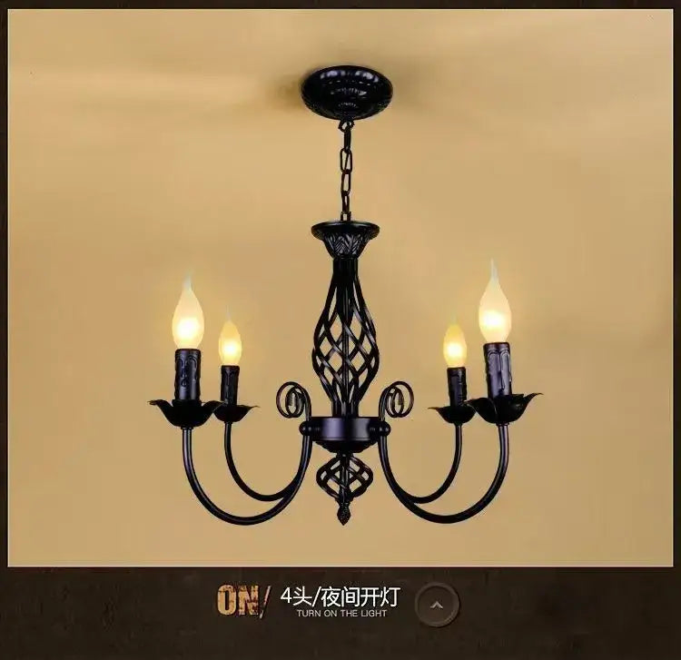 Black Iron Scroll Chandelier by Decorbites, four candle-style bulbs, ornate lattice center on Tampa Home & Garden Store
