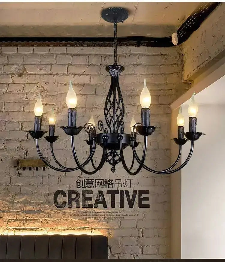 Black iron scroll chandelier with candle-style bulbs and ornate curved arms Decorbites on Tampa Home & Garden Store