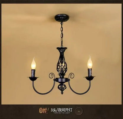 Black Iron Scroll Chandelier Decorbites three-light candlestick with curved arms and chain on Tampa Home & Garden Store