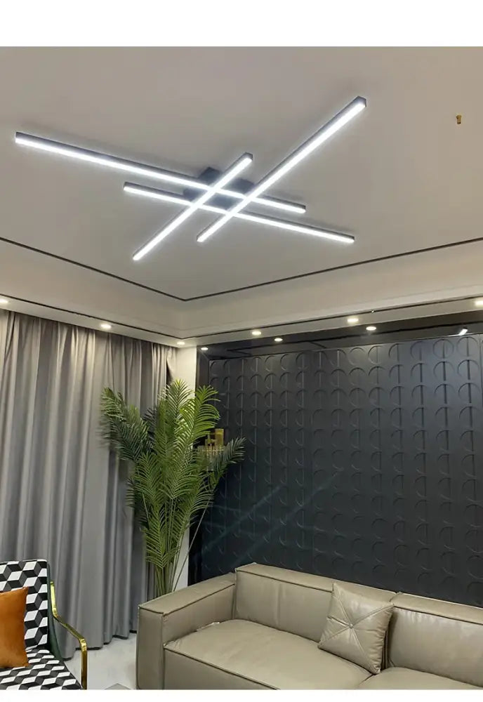 Black Square LED chandelier, modern ceiling light with intersecting LED bars over a sofa on Tampa Home & Garden Store