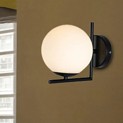 Black Opal Wall Sconce with black metal frame and frosted glass globe Decorbites on Tampa Home & Garden Store