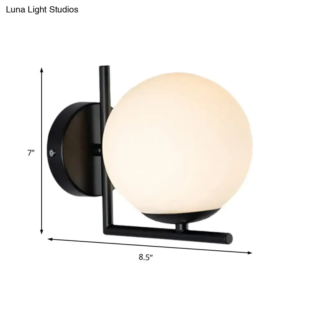 Black Opal Wall Sconce by Decorbites with black metal frame and frosted globe 7 in tall on Tampa Home & Garden Store