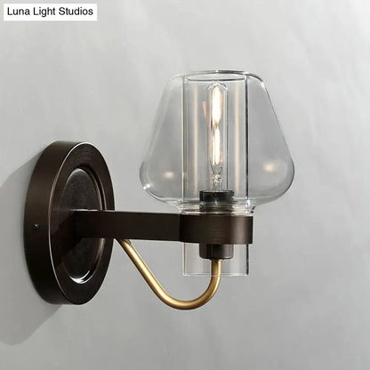 Black brass glass mushroom wall sconce with clear shade by Decorbites on Tampa Home & Garden Store