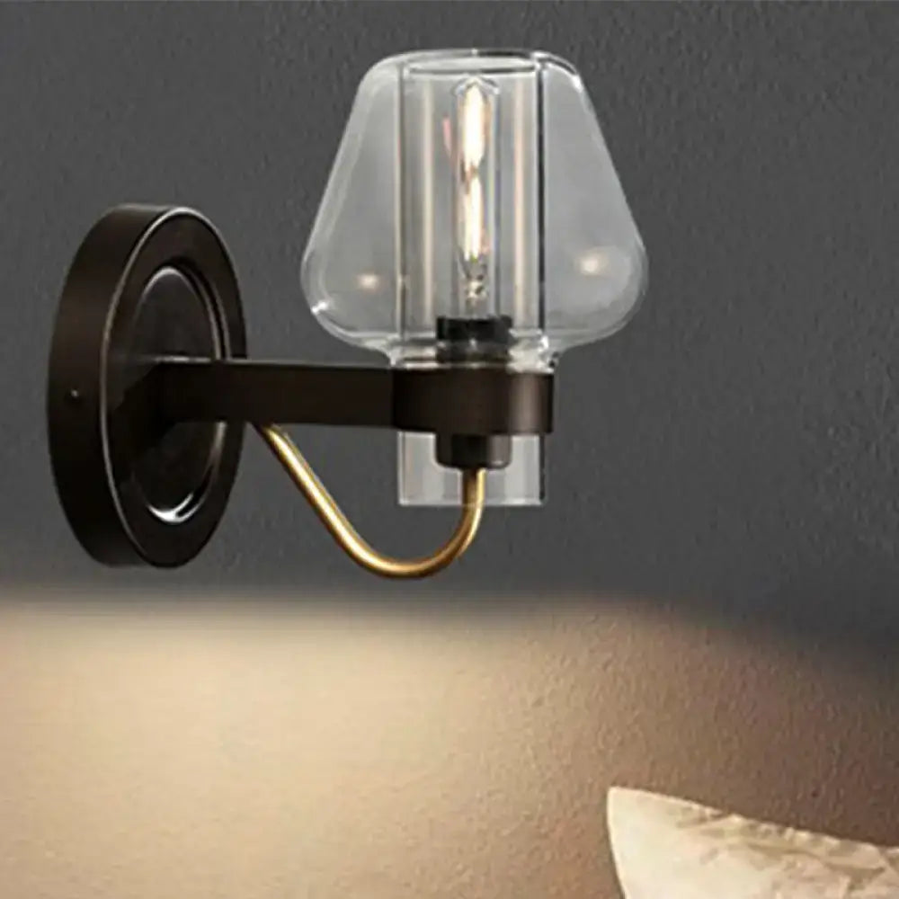 Black brass glass mushroom wall sconce by Decorbites with clear glass shade and exposed bulb on Tampa Home & Garden Store