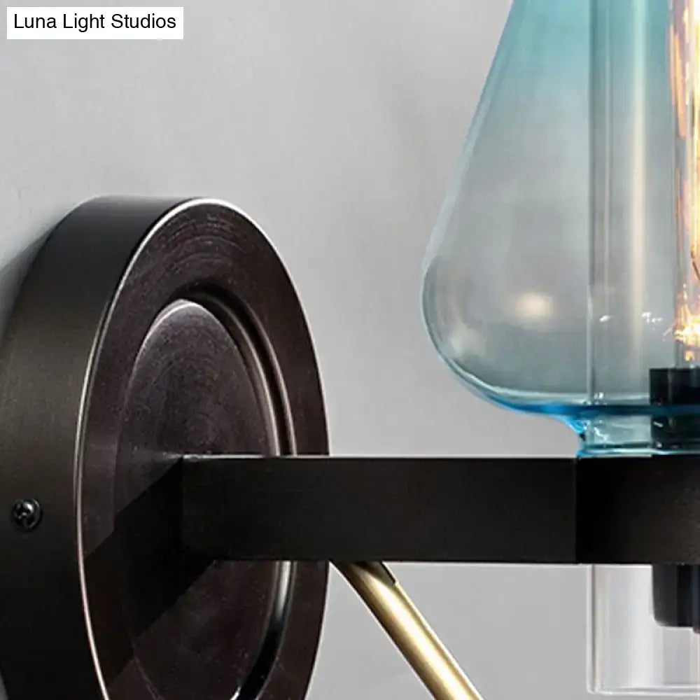 Blue Glass Tapered Wall Sconce by Decorbites with dark metal backplate on Tampa Home & Garden Store