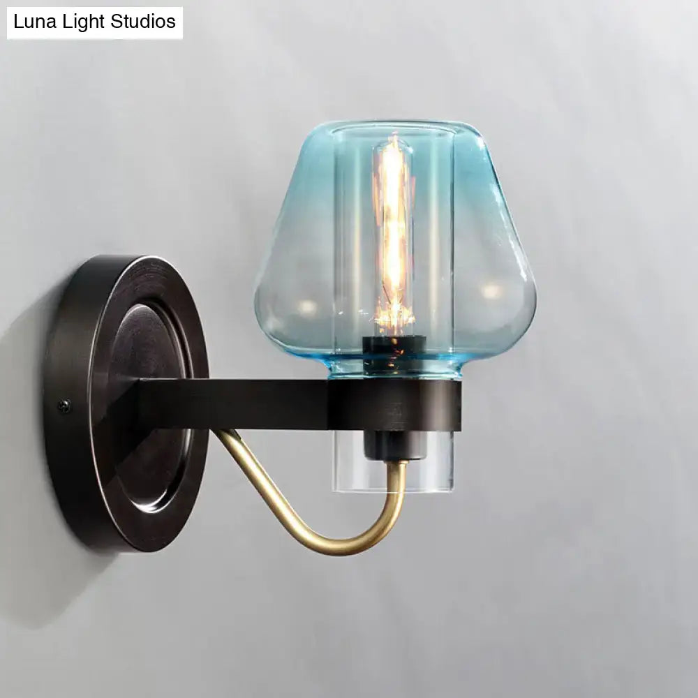 Blue Glass Tapered Wall Sconce with bronze backplate and brass curved arm by Decorbites on Tampa Home & Garden Store