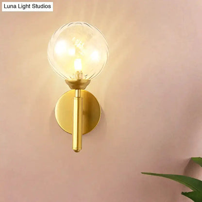 Modern brass glass sphere wall lamp with clear globe by Decorbites on Tampa Home & Garden Store