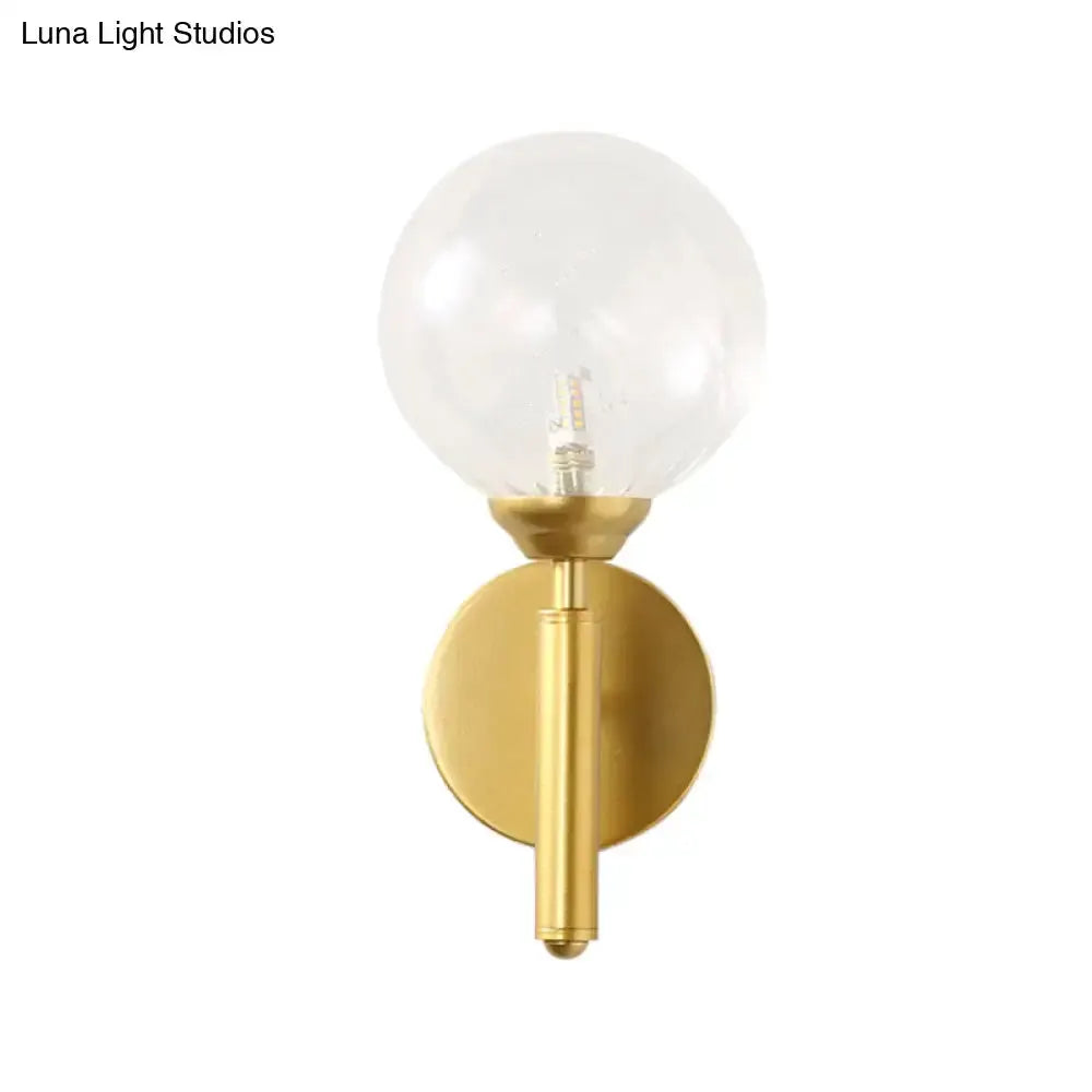 Modern brass glass sphere wall lamp fixture with clear globe, gold backplate Decorbites on Tampa Home & Garden Store