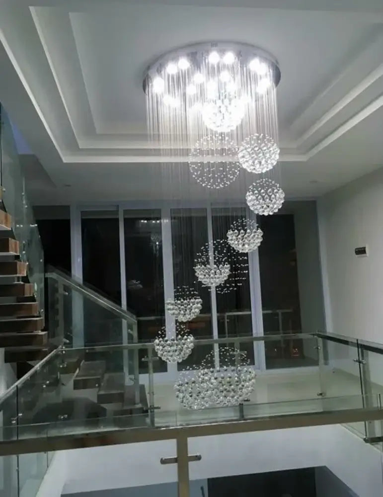 Crystal Raindrop Chandelier by Decorbites; crystal spheres cascade from a ceiling chrome plate on Tampa Home & Garden Store