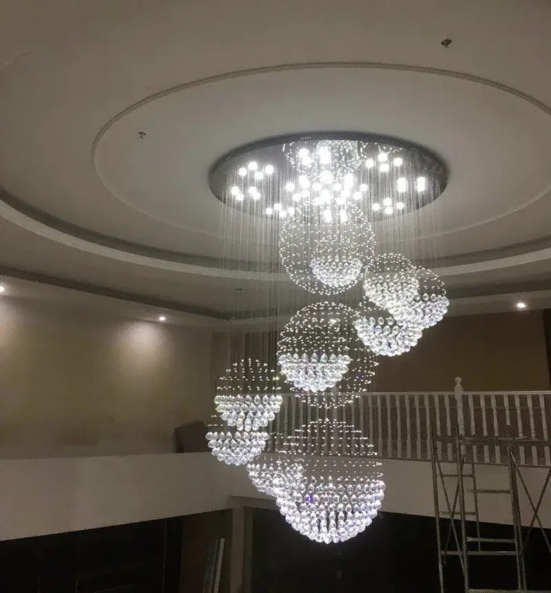 Crystal Raindrop Chandelier by Decorbites; clear crystal bead cascades form spiral clusters from a circular ceiling mount on Tampa Home & Garden Store