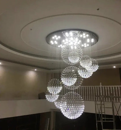 Crystal Raindrop Chandelier by Decorbites; clear crystal bead cascades form spiral clusters from a circular ceiling mount on Tampa Home & Garden Store