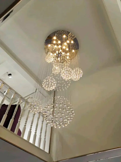 Crystal Raindrop Chandelier by Decorbites with cascading clear glass droplets and light on Tampa Home & Garden Store