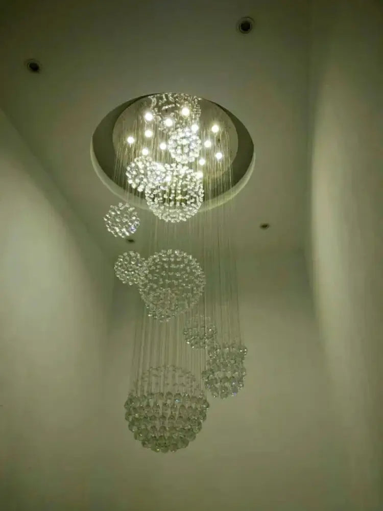 Crystal Raindrop Chandelier by Decorbites, clear crystal drops cascade from a ceiling mount on Tampa Home & Garden Store