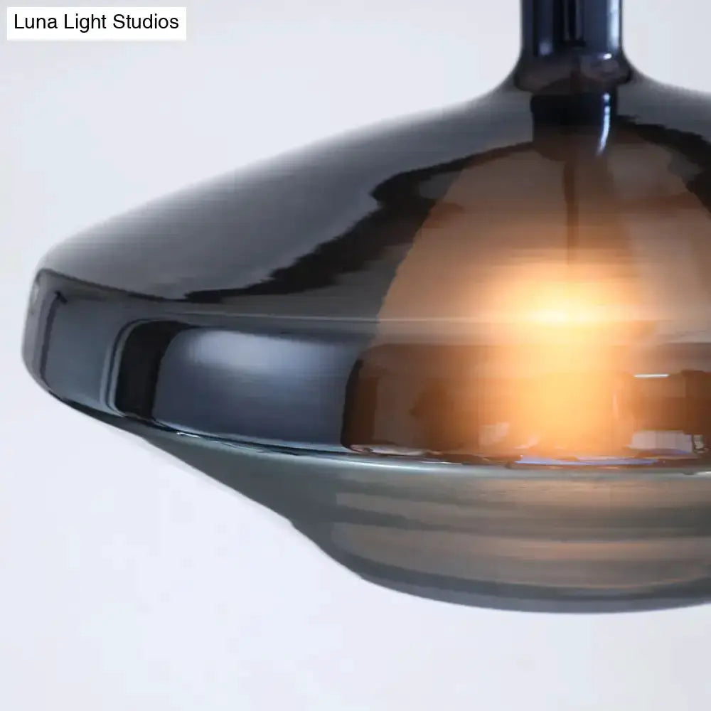 Modern amber and copper geometric pendant light by Decorbites with warm glow on Tampa Home & Garden Store