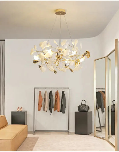 Gold Ginkgo LED chandelier by Decorbites; gold and white leaf design in a boutique showroom on Tampa Home & Garden Store