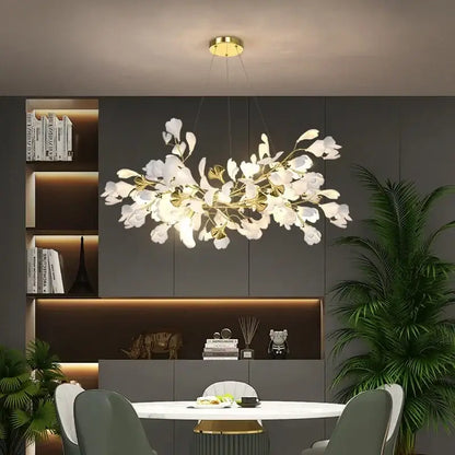 Gold Ginkgo LED chandelier by Decorbites, leaf-inspired ceiling fixture above dining table on Tampa Home & Garden Store