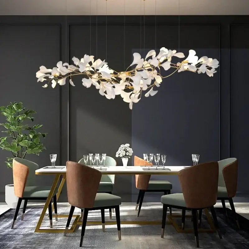 Gold Ginkgo LED Chandelier by Decorbites with white leaf accents over dining table on Tampa Home & Garden Store