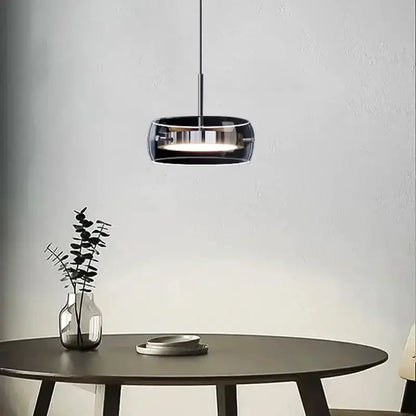 Modern black glass dining table pendant light by Decorbites over a round dining table on Tampa Home & Garden Store