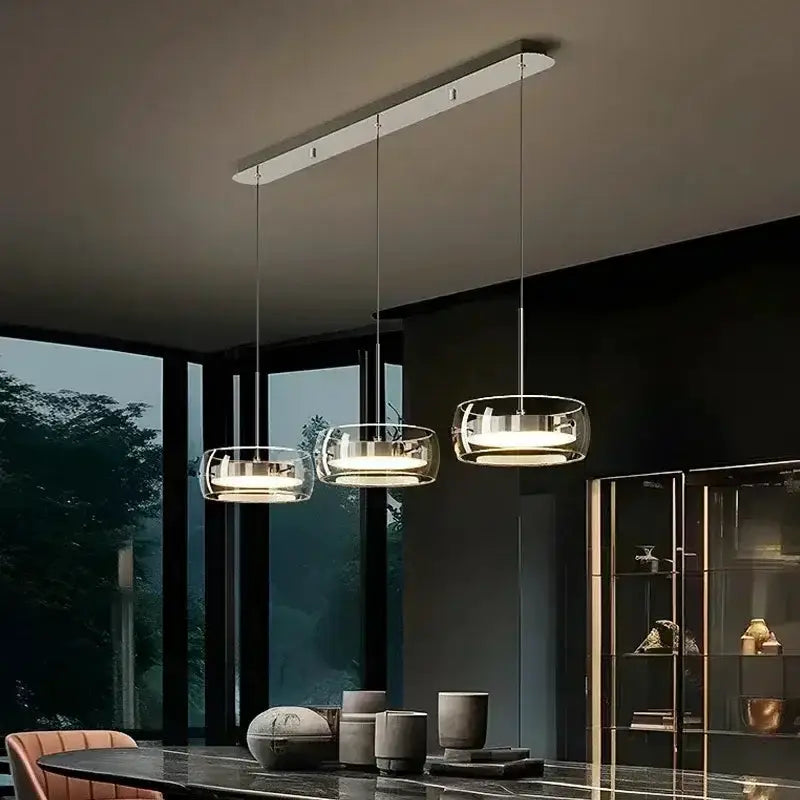 Modern black glass globe pendant lights by Decorbites, three hanging over a dining table on Tampa Home & Garden Store