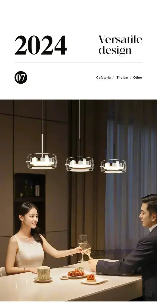 Modern black glass pendant lights hanging over a white dining table as a couple toasts with wine on Tampa Home & Garden Store