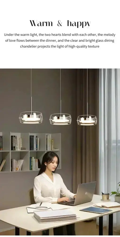 Decorbites modern black glass pendant lights, pendants over a white desk with a woman at a laptop on Tampa Home & Garden Store