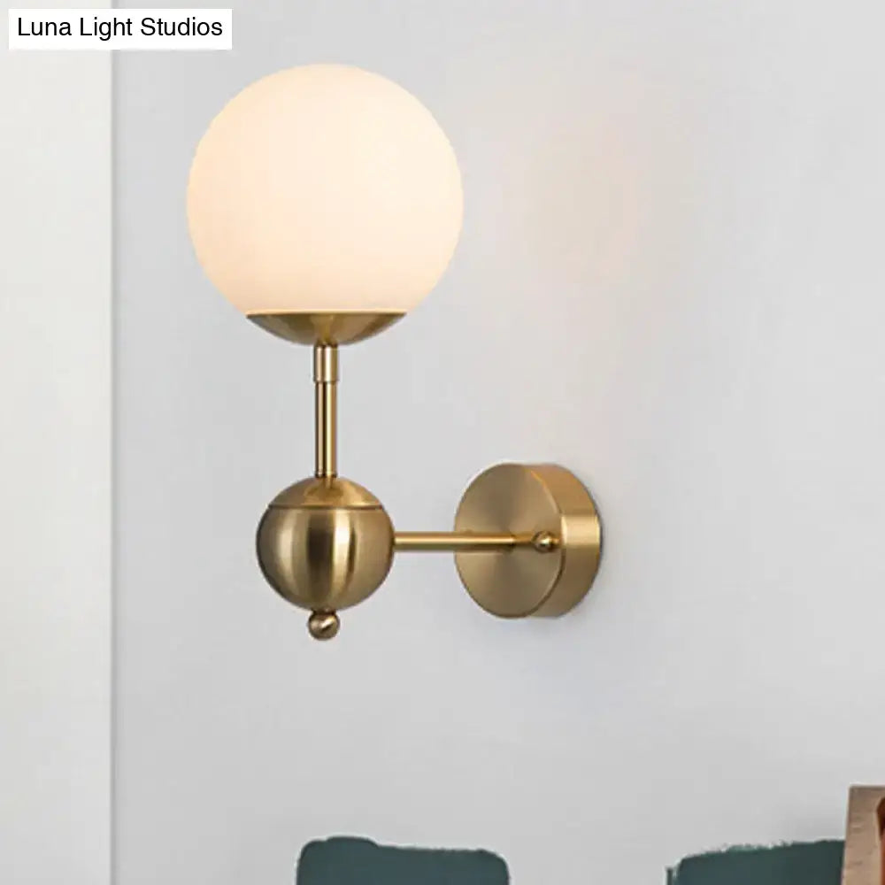 Brass Globe Bathroom Sconce with frosted globe shade, Decorbites brass finish on Tampa Home & Garden Store