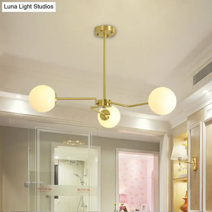 Gold Glass Ceiling Light flush mount with brass arms and three frosted glass globes on Tampa Home & Garden Store