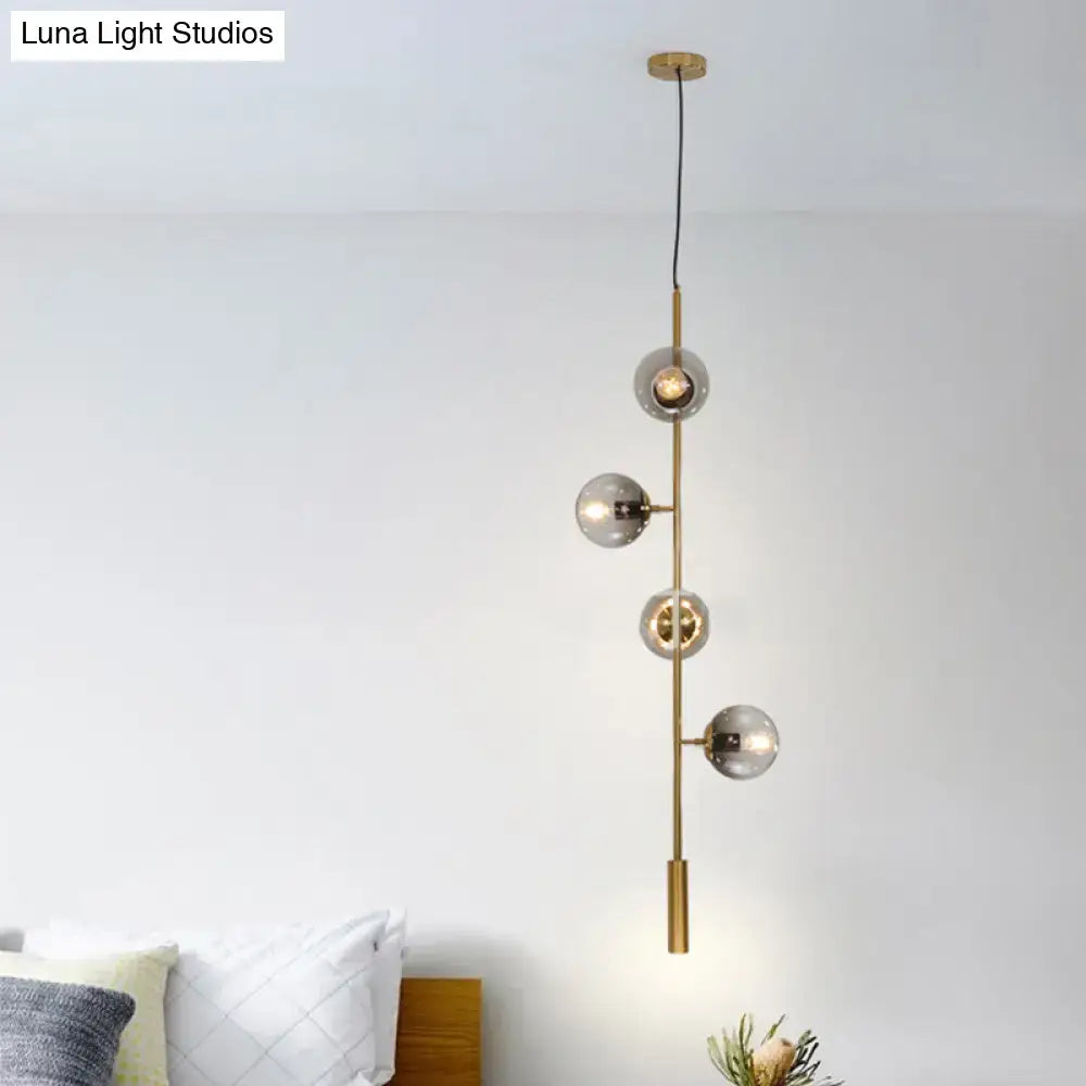 Gold glass linear chandelier with five globe bulbs on brass rod Decorbites on Tampa Home & Garden Store