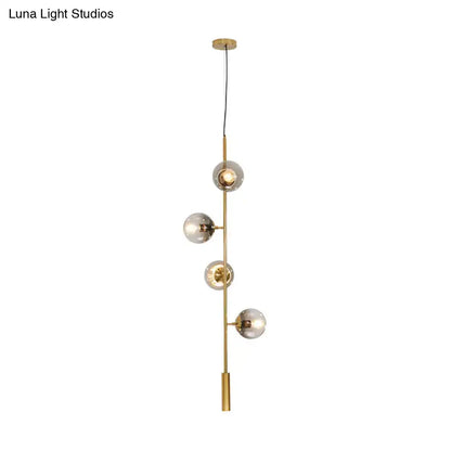 Gold Glass Linear Chandelier by Decorbites with brass stem and clear glass globes on Tampa Home & Garden Store