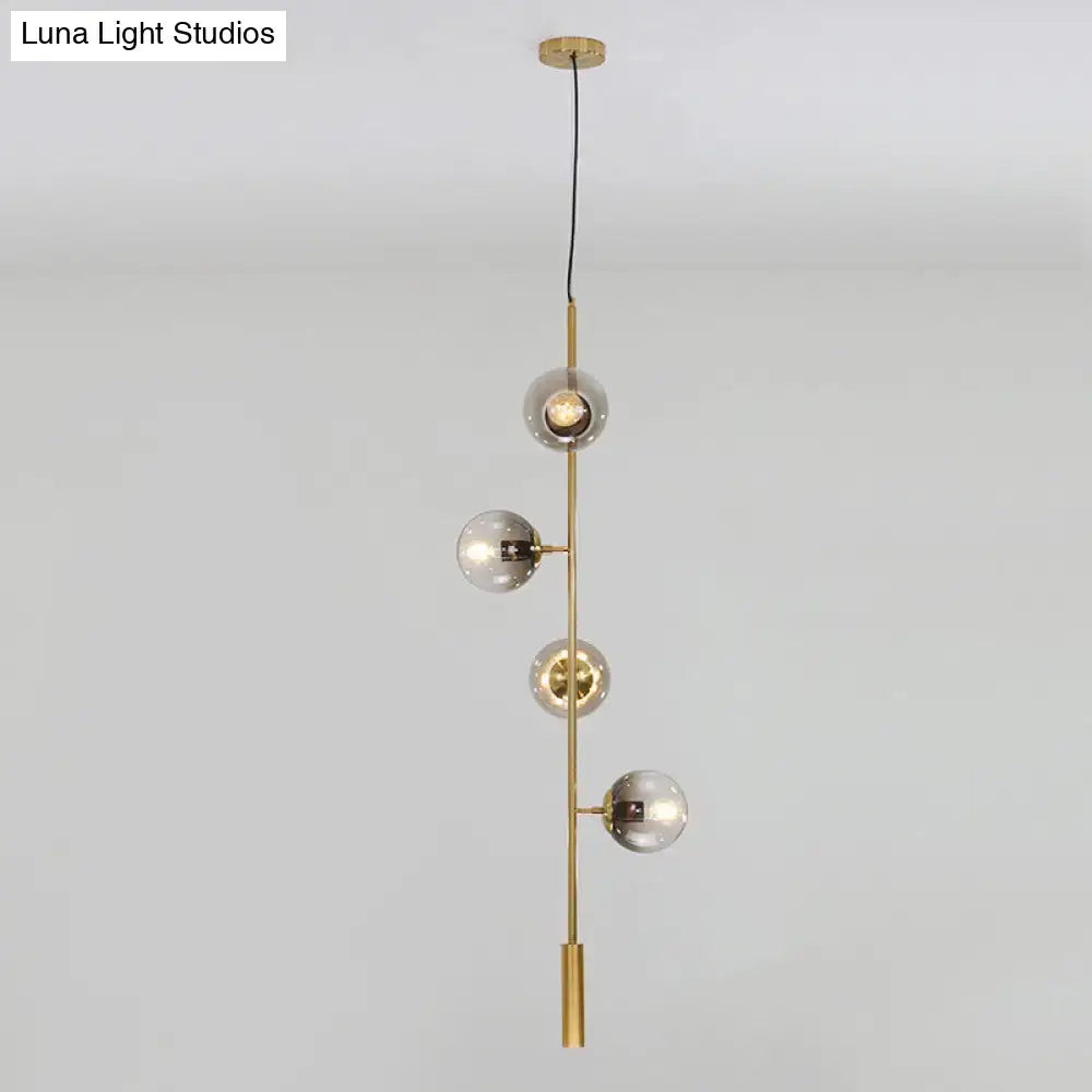 Gold Glass Linear Chandelier with 4 globe bulbs on brass vertical frame on Tampa Home & Garden Store