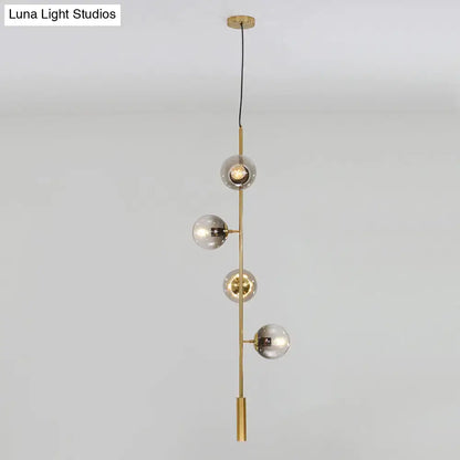 Gold Glass Linear Chandelier with 4 globe bulbs on brass vertical frame on Tampa Home & Garden Store