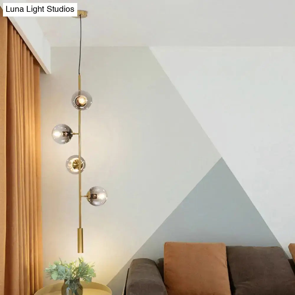 Gold Glass Linear Chandelier with brass vertical rod and clear glass globes Decorbites on Tampa Home & Garden Store