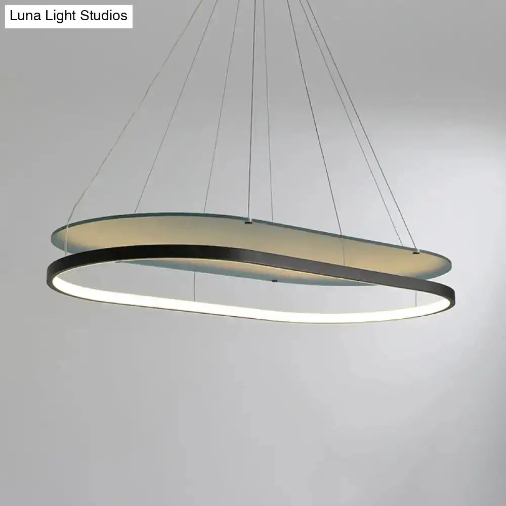 LED pendant chandelier in black and gold with two overlapping circular rings on Tampa Home & Garden Store