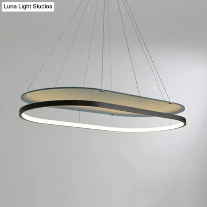 LED pendant chandelier in black and gold with two overlapping circular rings on Tampa Home & Garden Store