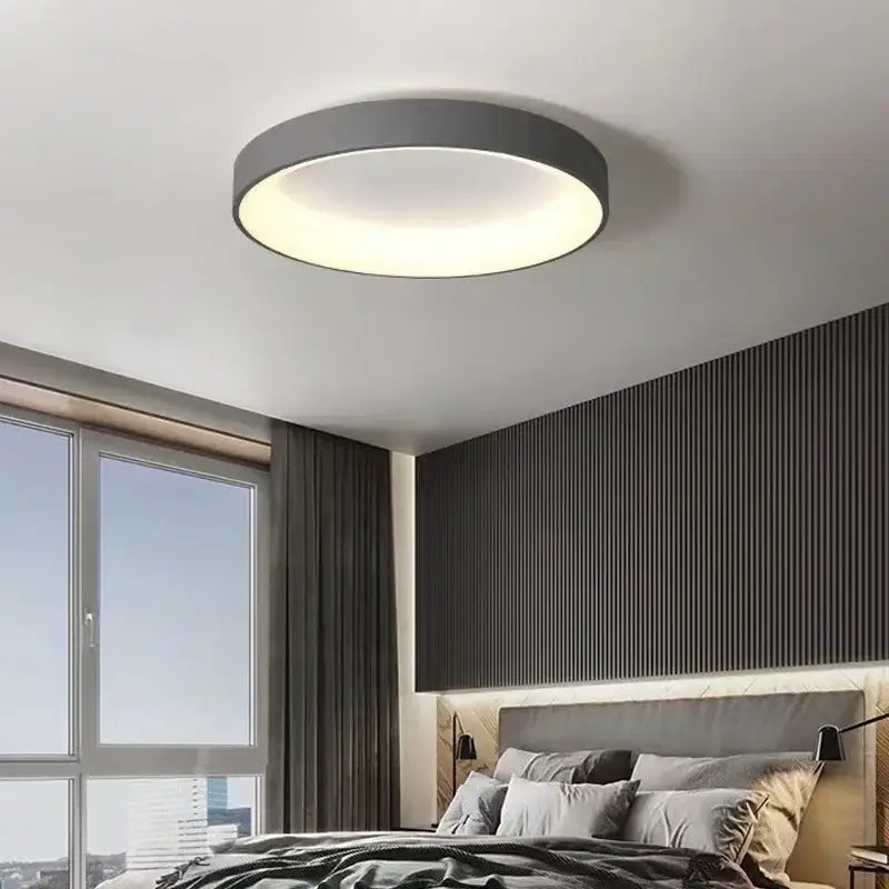 White Nordic ceiling light flush mount with dark gray rim and diffused glow on Tampa Home & Garden Store